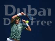 DUBAI, UNITED ARAB EMIRATES - FEBRUARY 27:  Denis Istomin of Uzbekistan returns a shot during his match against Marton Fucsovics of Hungary on day two of the Dubai Duty Free Tennis Championship on February 27, 2017 in Dubai, United Arab Emirates.  (Photo by Tom Dulat/Getty Images)